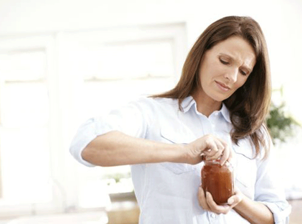 woman opening jar