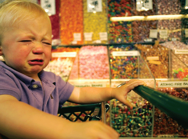 Child crying over sweets