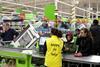 AT THE TILLS: The reaction to Asda's Black Friday sale has been phenomenal. Excited shoppers rush to Asda stores to snap up the best Black Friday deals. Customers have been queuing since 5am to get their hands on the deals, with a 40" Polaroid LED TV at £