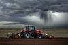Tractor field farming storm