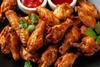 Crispy Chicken Wings with Dipping Sauces. Homemade roasted in the air fryer. - stock photo