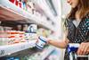 woman shopping for cream - getty
