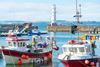 Fishing boats in Newhaven harbour,with Lighthouse behind,Edinburgh,Scotland,UK - Gettu