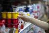 Shopper buying yoghurts