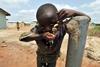 boy drinking water charity