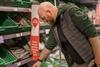 supermarket shopper man basket co op coop cucumber fruit veg GettyImages-1467052194