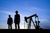 Oil pump and silhouettes of people