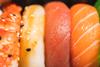 Nigiri sushi close up in a take away box - stock photo