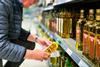 olive oil shelf aisle shopper GettyImages-1429975593