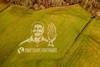 A grass art painting in Yorkshire, depicting Ghanaian cocoa farmer Bismark Kpabitey, created to mark Fairtrade Fortnight. Credit- Sand In Your Eye