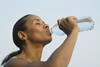 Woman drinking bottled water