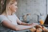 woman on laptop in kitchen
