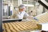 Woman on sweet biscuit production line
