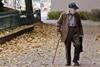 photo-of-elderly-man-walking-on-pavement-3093287