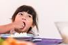 kid eating rice