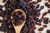 Raisins on a wooden spoon