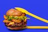 Impossible Foods plant-based vegan Impossible burger lifestyle shot with tongs