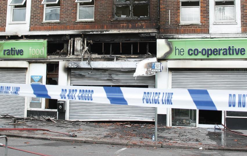 Final riot-damaged Co-op Group store reopens | News | The Grocer