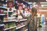 woman looking at shelves- Getty