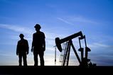 Oil pump and silhouettes of people