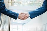 Business handshake shake hands Getty