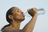 Woman drinking bottled water