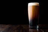 Stout beer on wooden surface