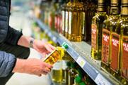 olive oil shelf aisle shopper GettyImages-1429975593