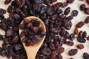 Raisins on a wooden spoon