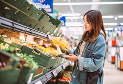 woman in supermarket - getty