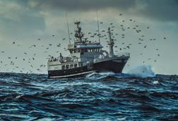 Fishing boat sailing at rough sea - stock photo - Getty Images