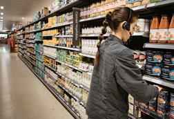 Waitrose staff worker partner aisle pasta sauces ambient