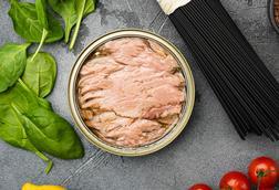 Tuna canned fish seafood, on gray stone table background, top view flat lay - Getty