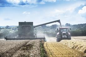 comvbine harvestor and tractor - getty