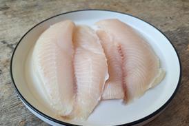 white fish on plate - getty