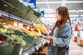woman in supermarket - getty