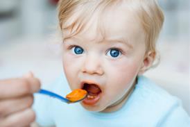 Baby being spoon-fed
