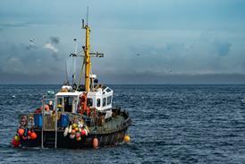 Commercial Fishing Trawler On The Calm Water Of The Atlantic Ocean In Scotland, UK - stock photo - Getty Images