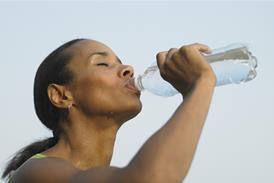 Woman drinking bottled water