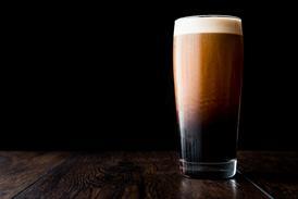 Stout beer on wooden surface