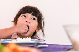 kid eating rice