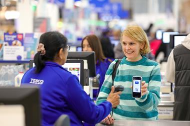 tesco store checkout clubcard pay customer worker (1)