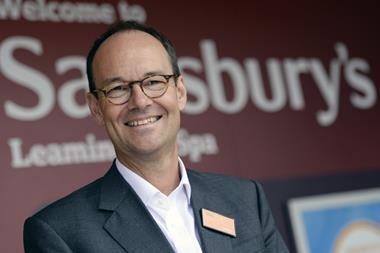 Mike Coupe with Sainsburys logo