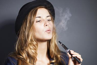 girl smoking vape e-cigarette
