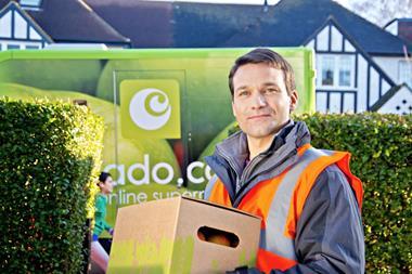 Ocado driver with veg box