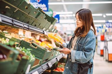 woman in supermarket - getty