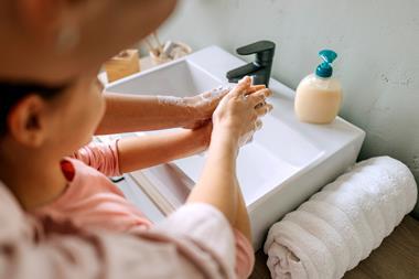 child washing hands
