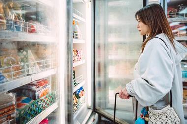 women in freezer aisle - getty