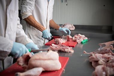 butcher in chicken site - getty