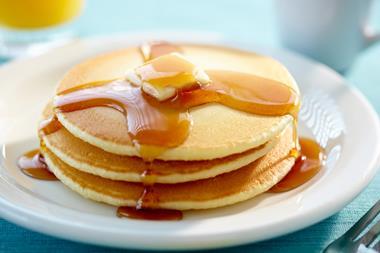 pancake stack with butter and maple syrup